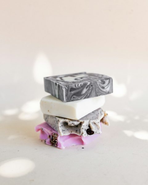 A stack of four handmade soap bars